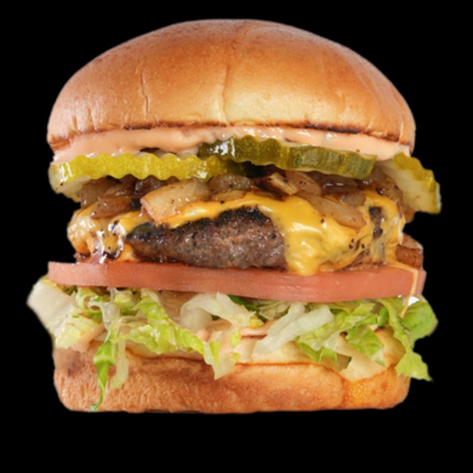 Aljoom BBQ burger with melted cheese, grilled onions, pickles, tomato, and lettuce on a bun.